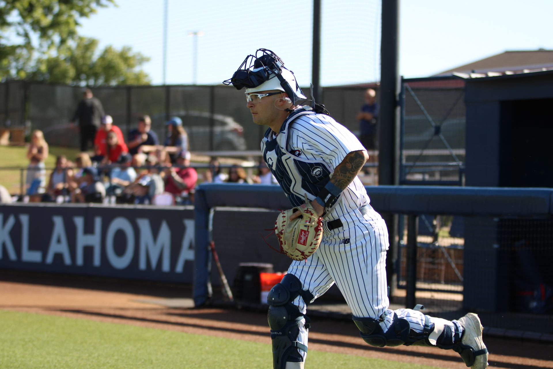 Founder of Rally Roast Coffee as a youth baseball catcher running off the field